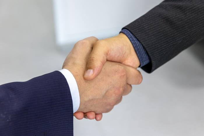 Handshake at closing